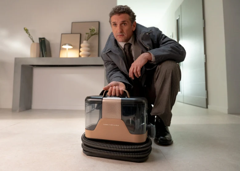 Man with vacuum cleaner