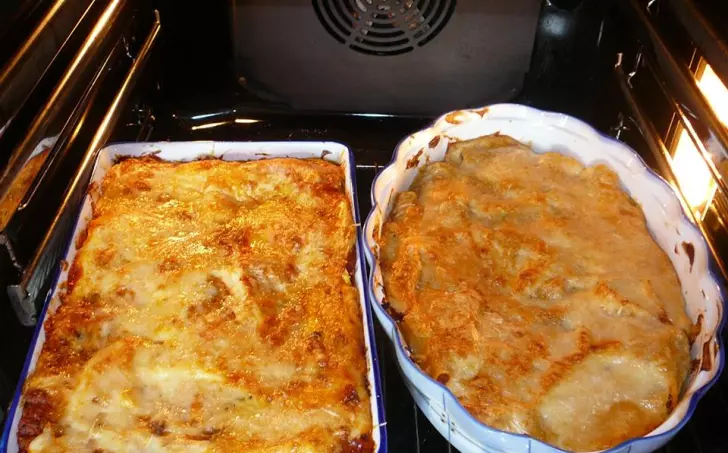 Baked lasagna dishes in oven