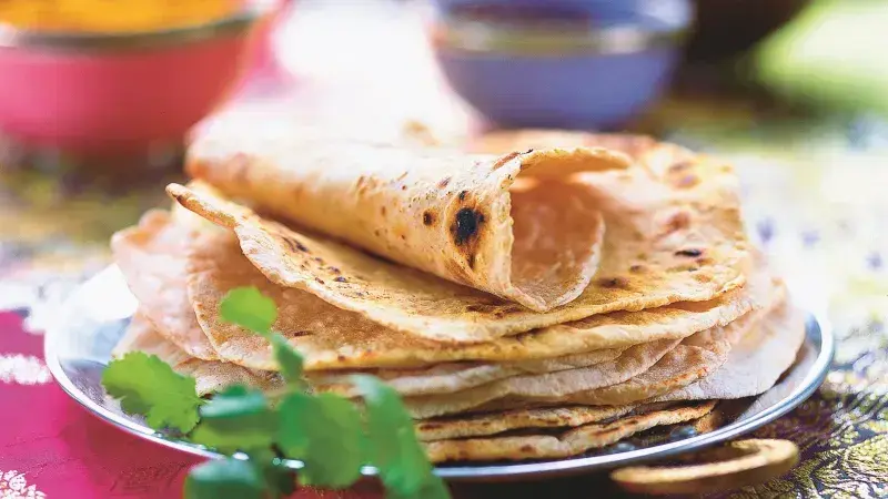 Stack of chapatis with cilantro