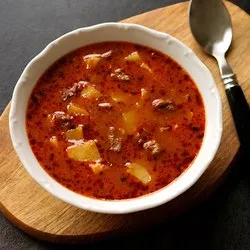 Red soup with vegetables and meat